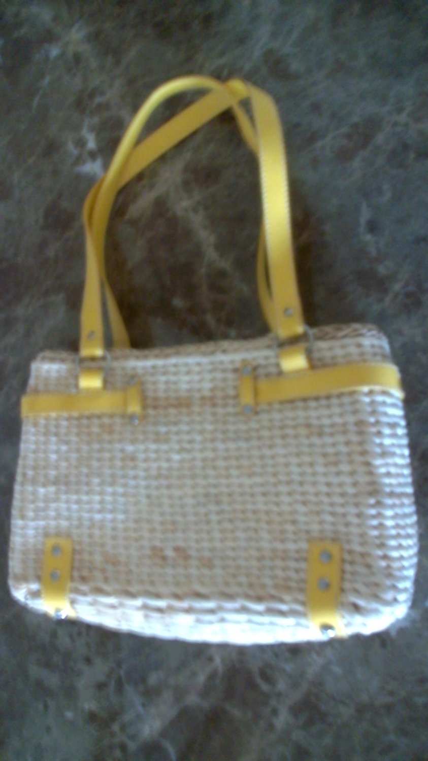 Straw purse with faux leather yellow straps