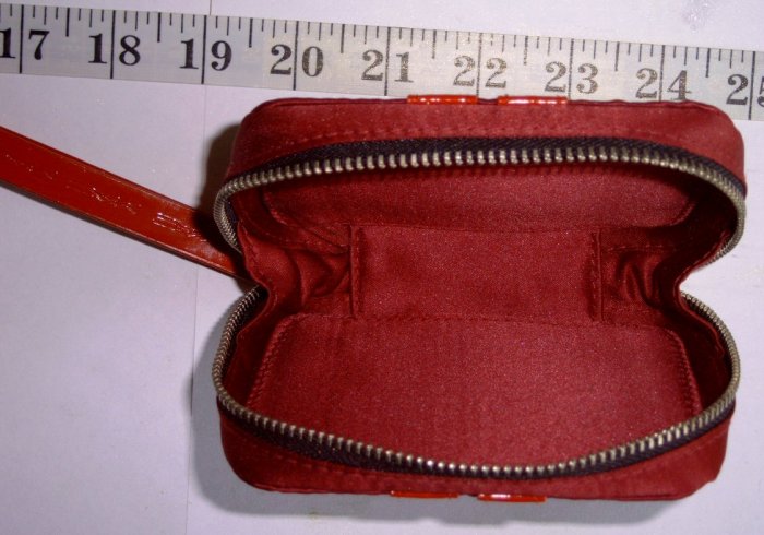 Small zippered MAC makeup bag.