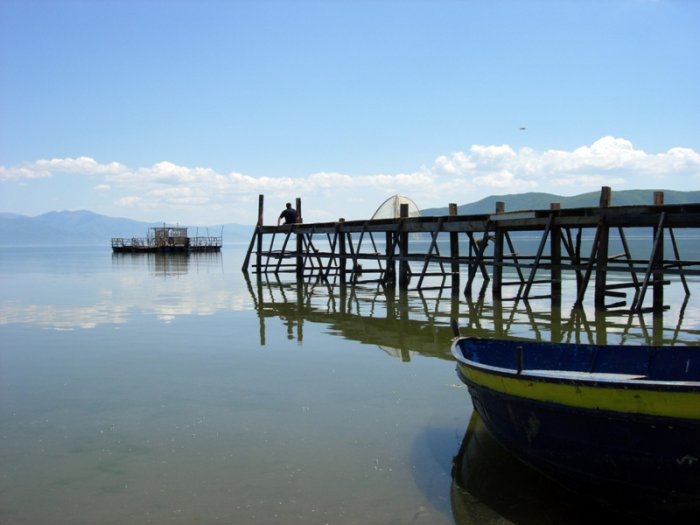 sitting on the dock of a bay