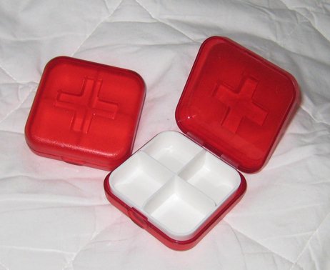 Pill vitamin box shaped like first aid kit