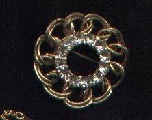 Vintage goldtone and rhinestone circle pin