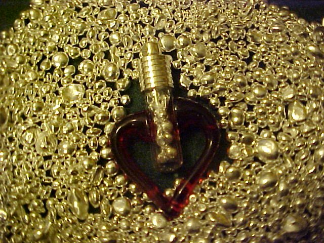 PURE SILVER BULLION ENCASED IN BLOWN GLASS RED HEART