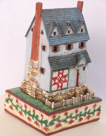 Jim Shore House With Red Triangle Quilt