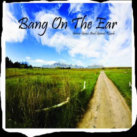 Green Grass And Gravel Roads