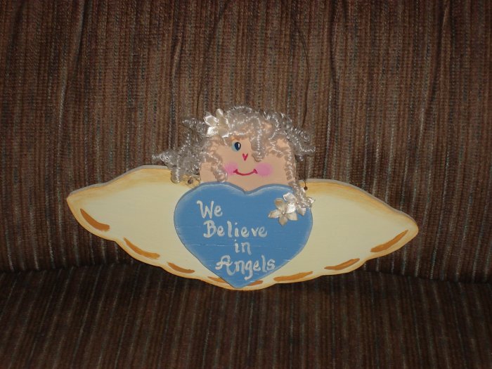 "We Believe In Angels" signs