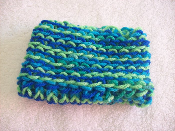 Hand-knitted doll hat, blue and green
