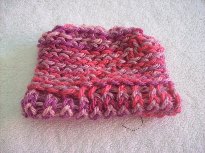 Hand-knitted doll hat, pink