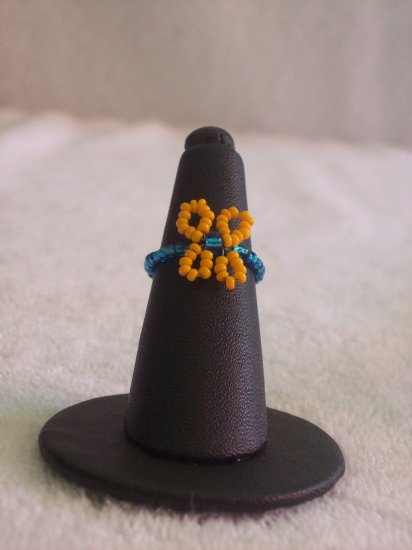 Butterfly ring, orange on blue