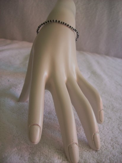 Beaded bracelet, black and clear