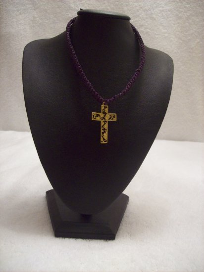 Gold floral cross on purple square