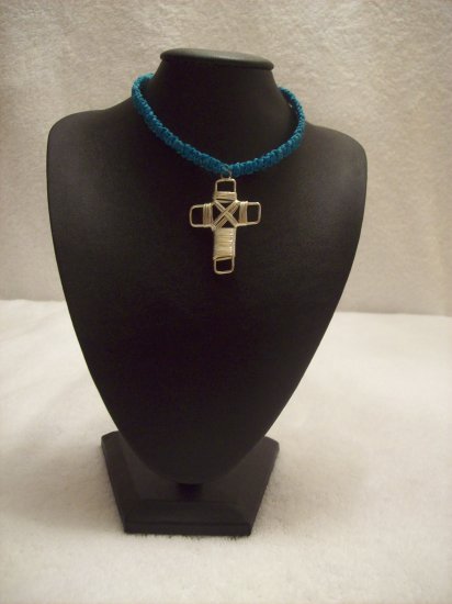 Silver wire cross on royal blue square
