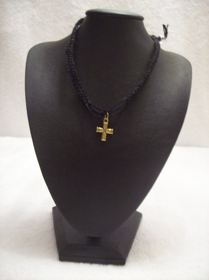 Gold cross on black square/open square