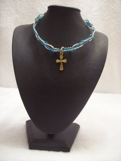 Gold cross on blue and turquoise square/switchback