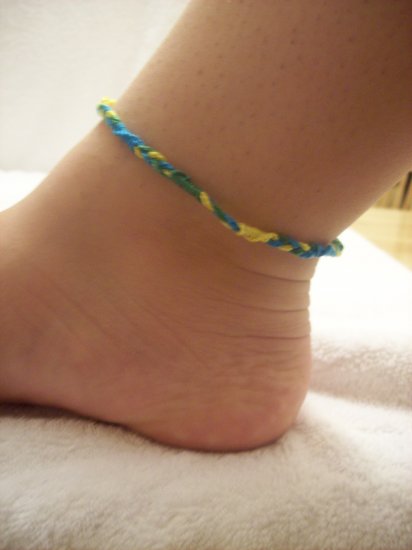 Blue, green, and yellow braided wrap