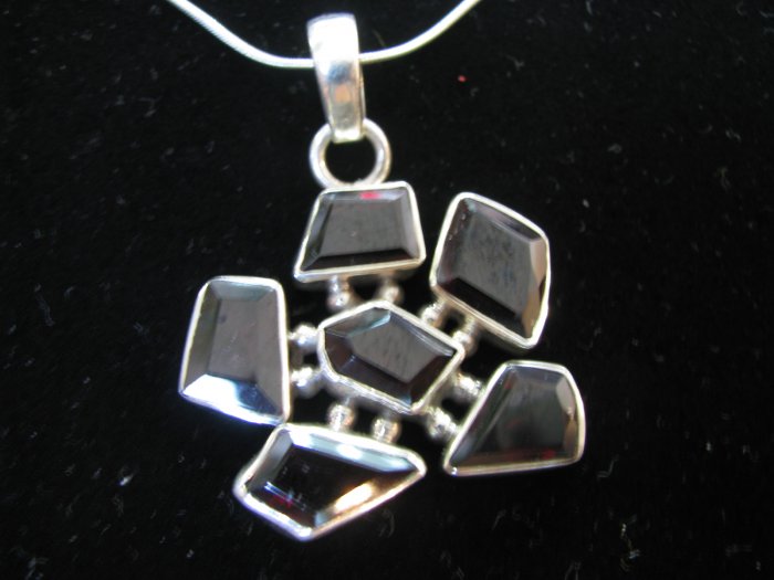 Classic design with garnet stones.
