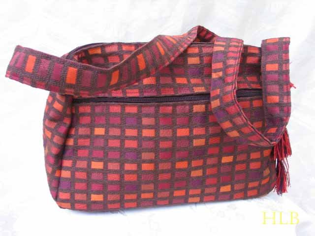 Nava - Elegant Woven Orange Fabric 4 Pockets Shoulder Handbag