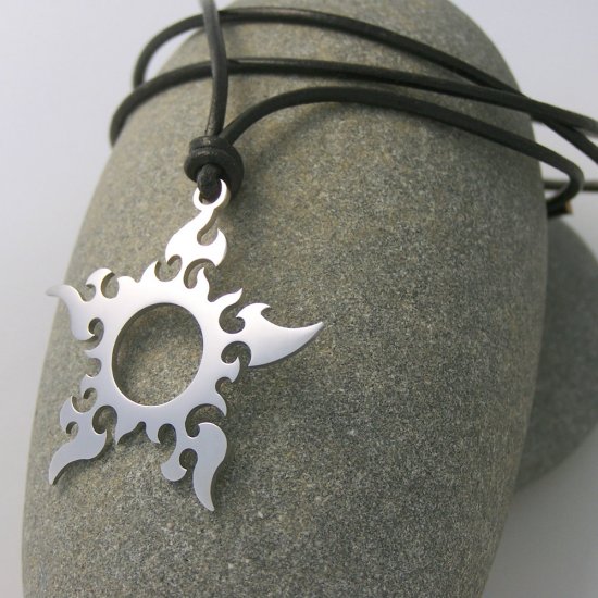 Sun Tribal stainless steel pendant on natural leather cord. A surfer style necklace