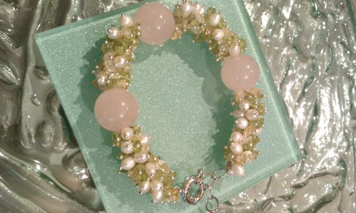Multi gemstones and freshwater cultured white pearls in sterling sliver bracelet. 9’’