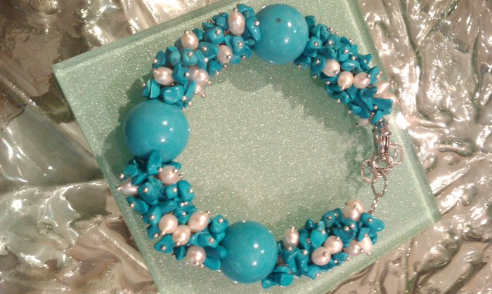Multi gemstones and freshwater cultured white pearls in sterling sliver bracelet. 9’’