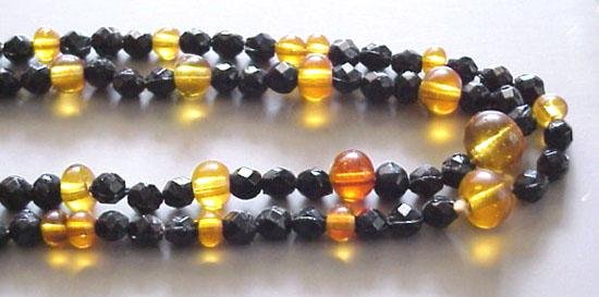 Long Vintage Art Deco Faceted Black and Amber Glass Beads