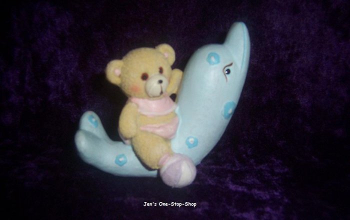 Bear and dolphin figurine