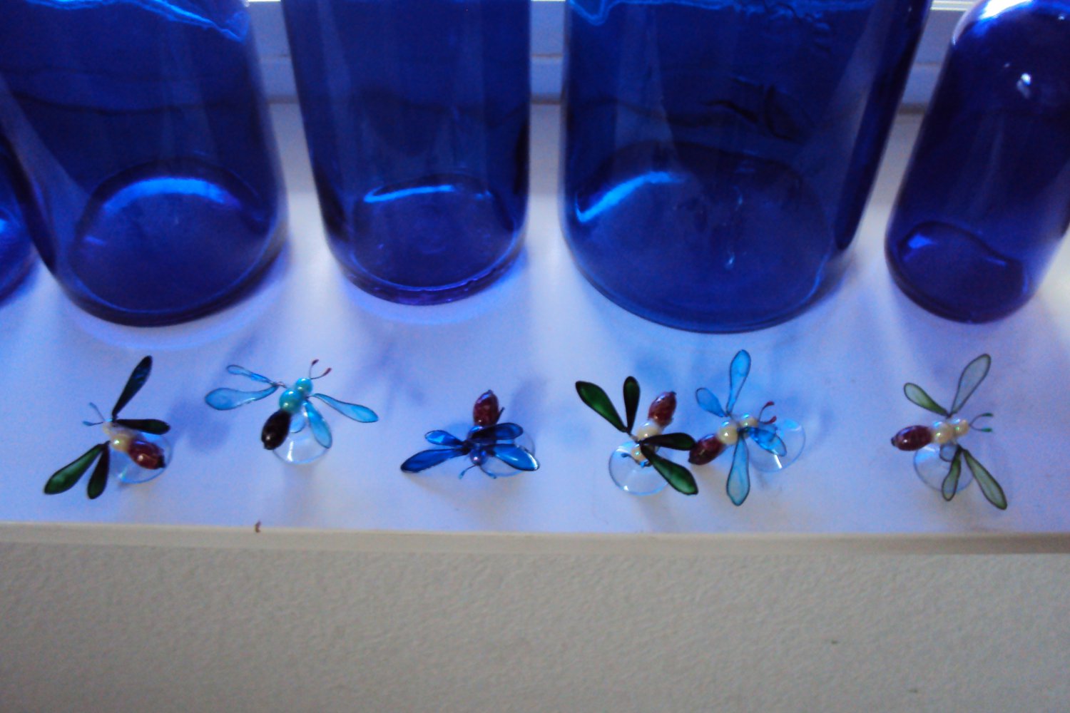 Beaded and stained glass window bugs