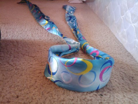 Blue headband with colorful swirls