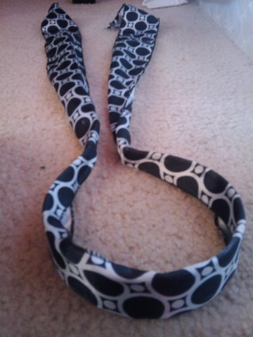 White headband with black poka dots and sqaures