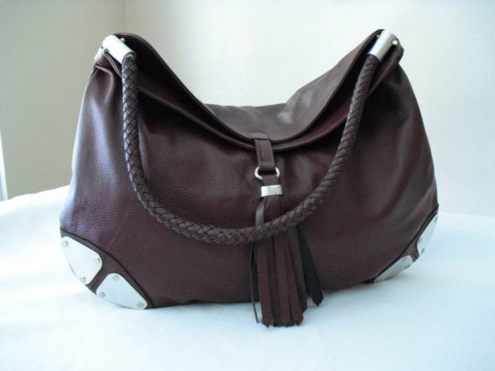 Wine Hobo Leather Handbag with metalic details.