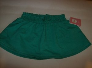 BRAND NEW GREEN SKIRT SIZE 12M WITH ELASTIC WAIST BAND