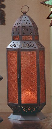 Tall Moroccan-Style Candle Lantern With Amber Glass Panels.