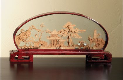 Waterside scene in oval glass case