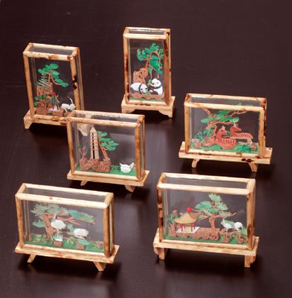 Glass and bamboo-encased cork sculptures
