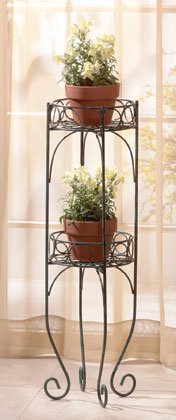 Antique two-tier metal planter shelf with verdigris finish