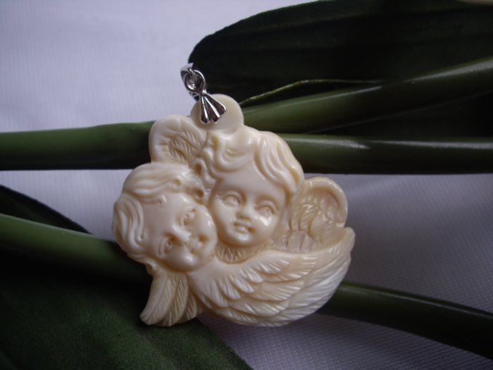 handcarved genuine shell cherub/ angel cameo pendant