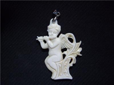 100%handcarved cherub playing on a flute pendent