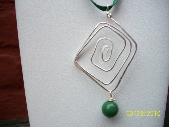 sterling pendant,green bead on green ribbon