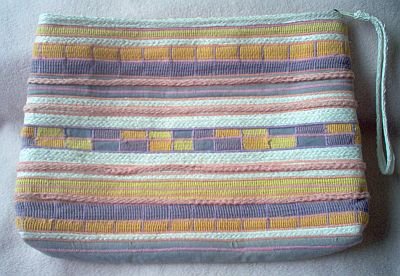 Almondo Originals made in the Phillippines clutch wrist strap purse in like new condition