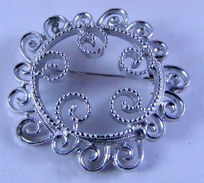 Sarah Coventry Filigree swirl circle pin Silvertone