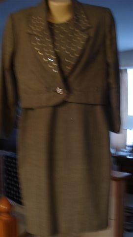 A Black and White Dress With Jacket.