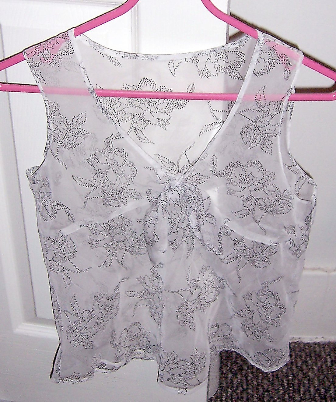 white sheer floaty sleeveless top with delicate lotus pattern in black