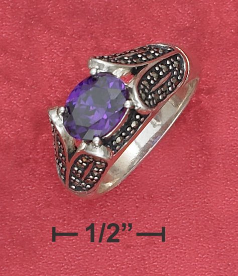 SYNTHETIC TANZANITE W/MARCASITE ENCRUSTED TAPERING BAND RING.