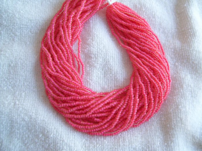 Yellow Coral color lined Czech seedbead hank 10/0
