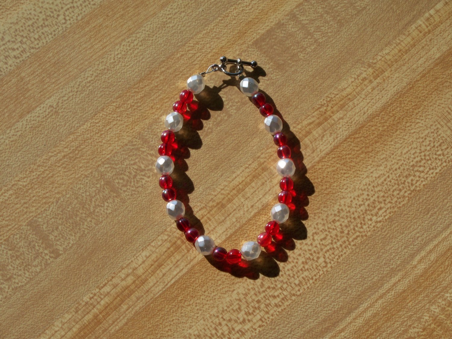 Red with faceted pearl colored beads