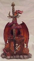 Dragon Figurine on Brick Wall with Letter Opener Dagger