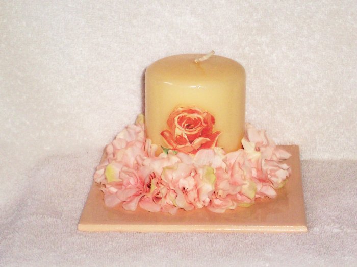 Decorated candle on decorated tile