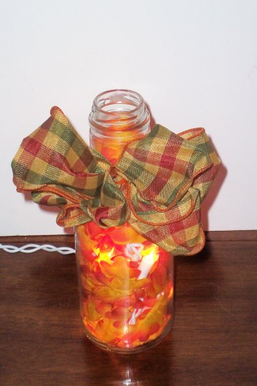 Lighted Bottle with Orange Flowers