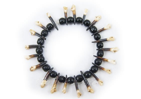 tibetan jewelry wrist chain made of fish and dog teeth with singularity and strangeness