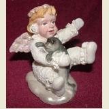 SNOW ANGEL FIGURINE HOLDING BABY SEAL