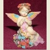 ANGEL FIGURINE WITH RAINBOW WINGS AND ROSES